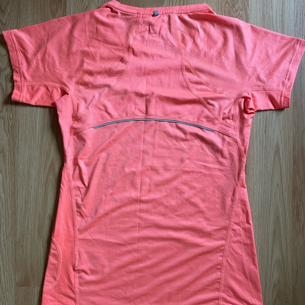 Coral sportswear top with silver detailing